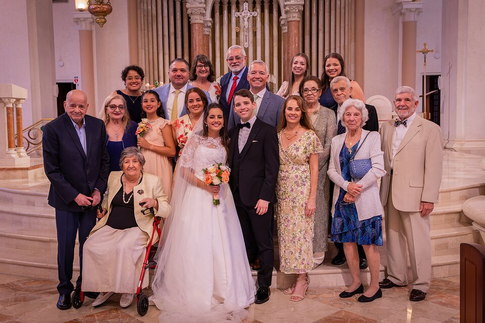 Eighteen family members gathered on the altar steps after the wedding